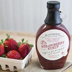 Blackberry Patch syrup pouring close-up highlighting rich strawberry texture