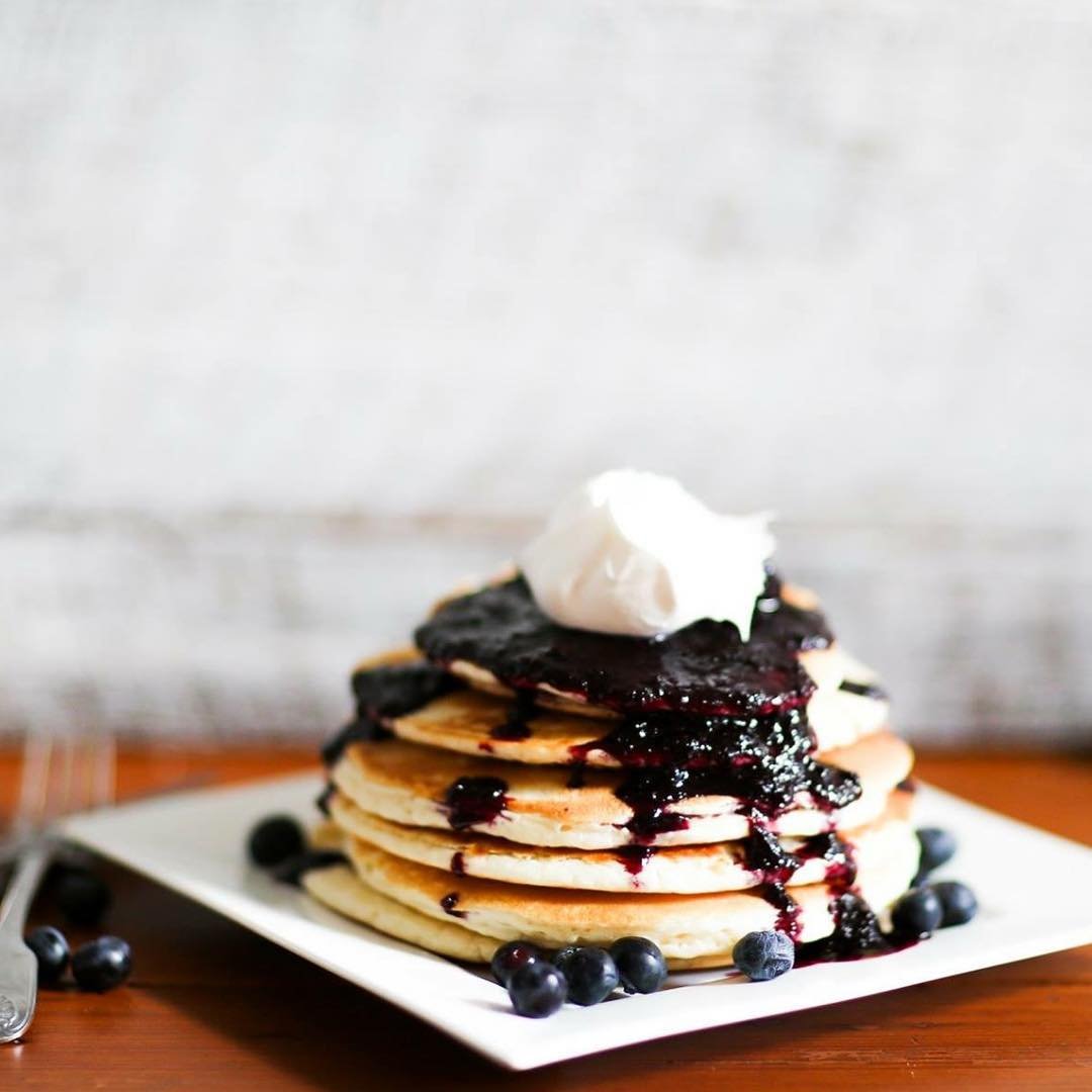 Bottle of Blackberry Patch syrup on breakfast table adding berry flavor to meal