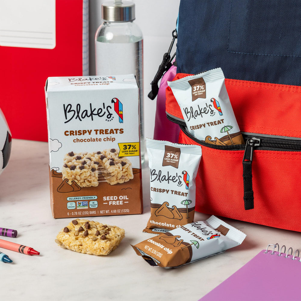 Family enjoying Blake's treats at a picnic illustrating shared snack appeal