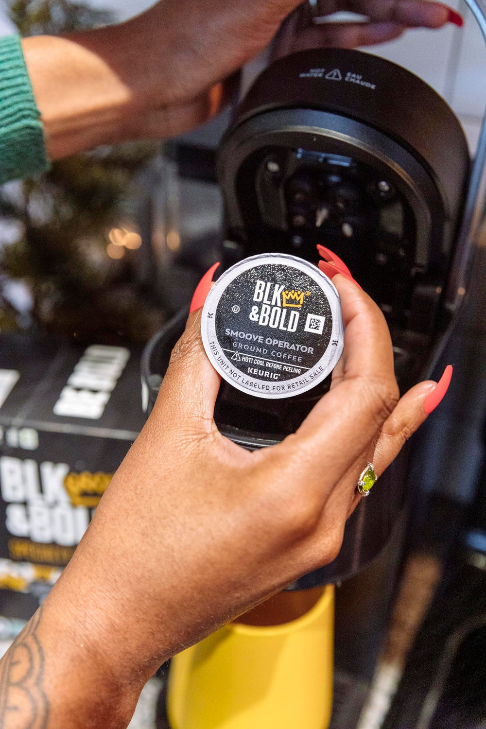BLK & Bold brewed cup pouring from pod, presents rich dark-roast appearance