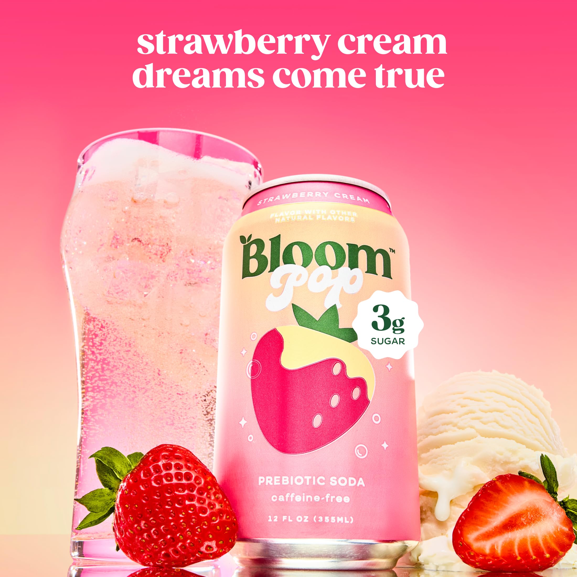 Bloom Nutrition Bloom Pop poured into a glass with ice showing bubbly texture and appealing strawberry-cream color