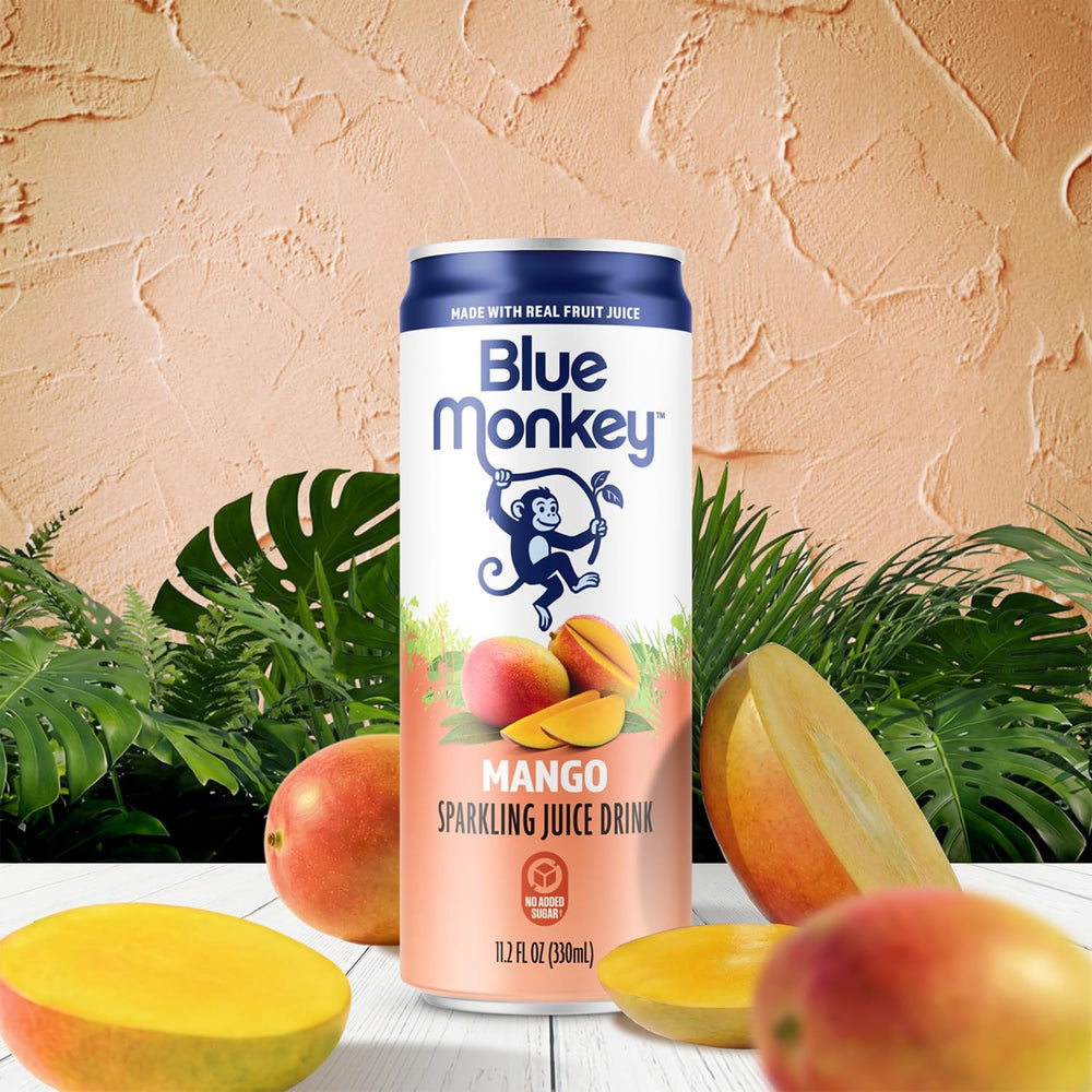 blue monkey close-up pour capturing mango juice texture and gentle bubbles for refreshing appeal