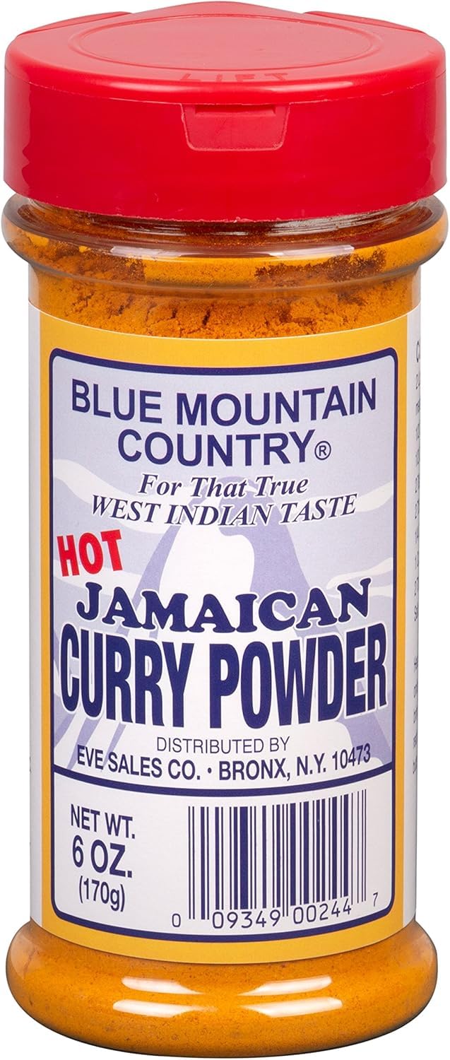 Blue Mountain Country bottle next to kitchen utensils for size and convenience