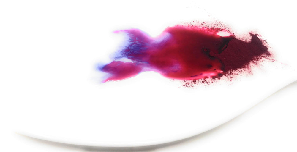 Bluechai powder pouring into saucepan to infuse color quickly for sauces