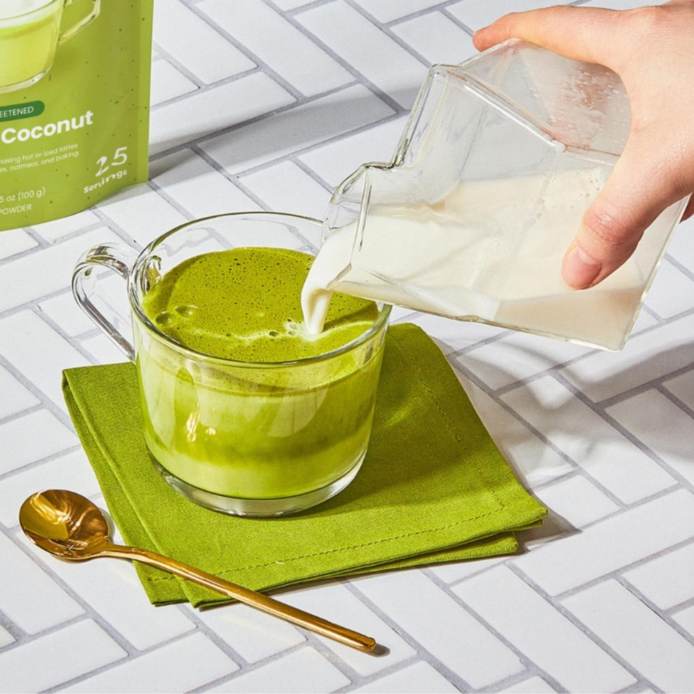 Blume matcha powder poured into smoothie showing easy mixing and versatility