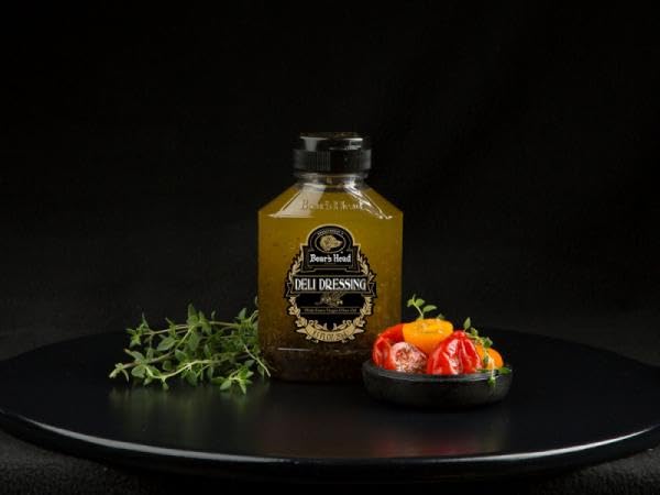 Boar's Head dressing being drizzled over salad for quick flavorful serving