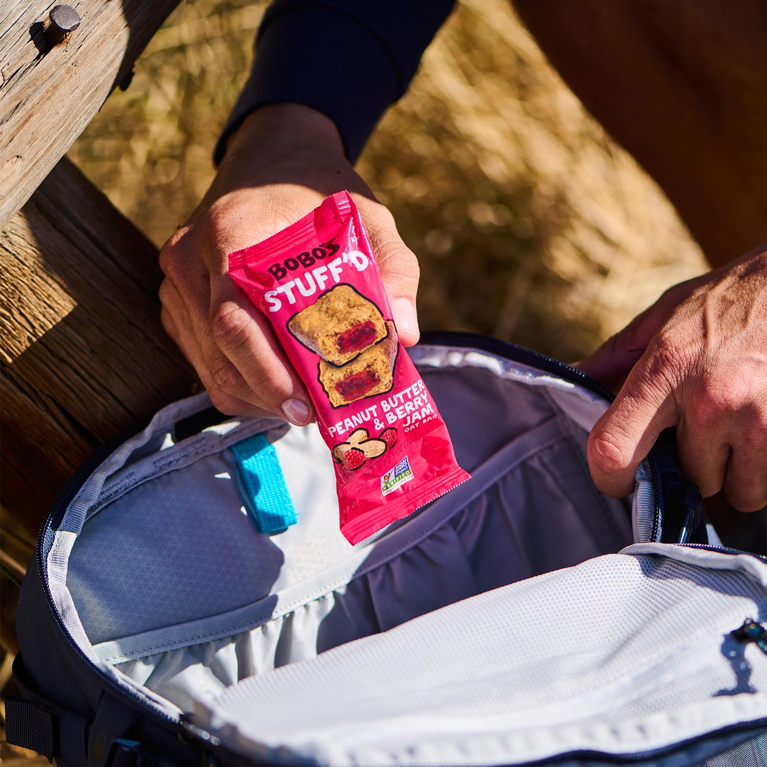 Bobo's bar in a backpack pocket outdoors illustrating energy for hikes and adventures