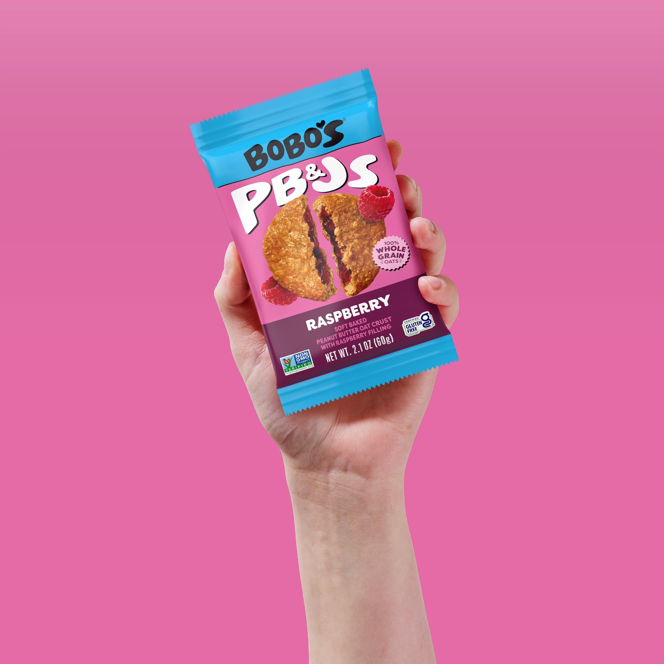 Bobo's bar in hand to show scale and portable snack portion sizing