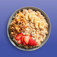 Bob's Red Mill oats served in a bowl with fruit showing quick nourishing breakfast