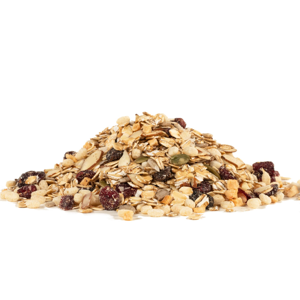Bob's Red Mill muesli on a breakfast table with fruit and coffee, wholesome meal setting