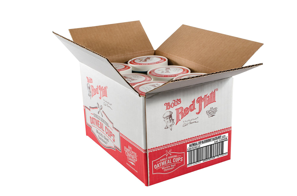 Bob's Red Mill oatmeal cup held next to hand showing single-serve portion