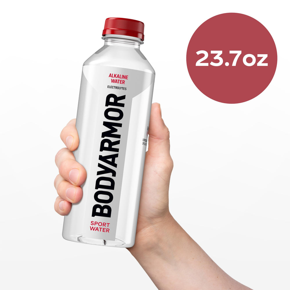BODYARMOR bottle in gym holder demonstrating spill-proof transport benefit