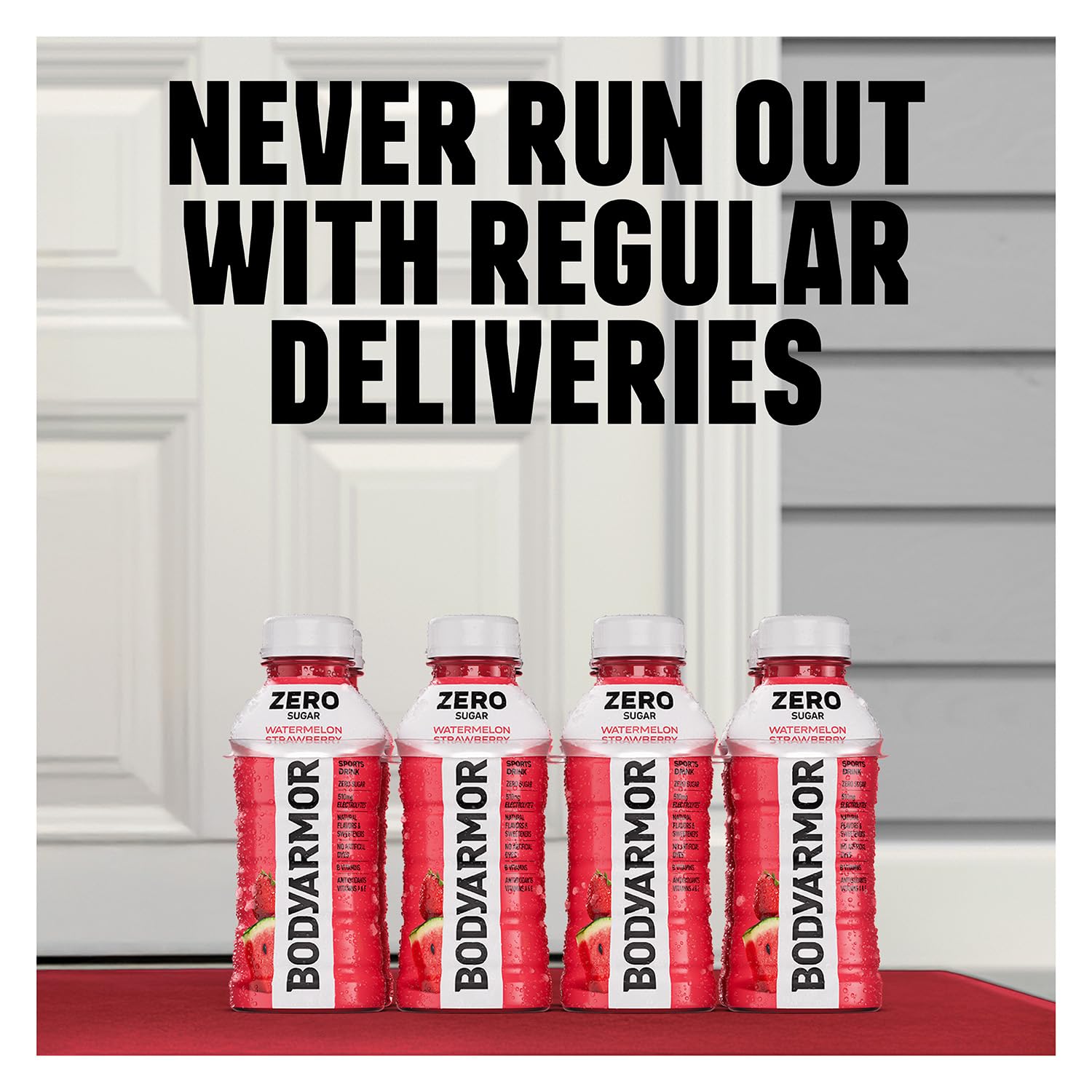 HAND holding BODYARMOR Zero Fruit Punch 16 oz bottle demonstrating portable on-the-go hydration benefit