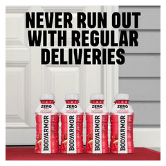 HAND holding BODYARMOR Zero Fruit Punch 16 oz bottle demonstrating portable on-the-go hydration benefit