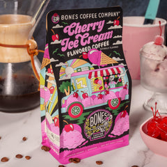 Bones Coffee Company spoon pouring grounds illustrating grind consistency for auto drip brewing