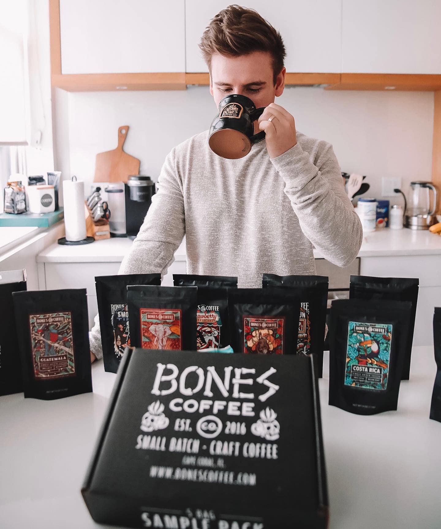 Bones Coffee Company bag beside hand for scale showing 12 oz portion advantage