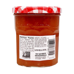 Close-up of fruit pieces in Bonne Maman preserves, visible mango and peach texture