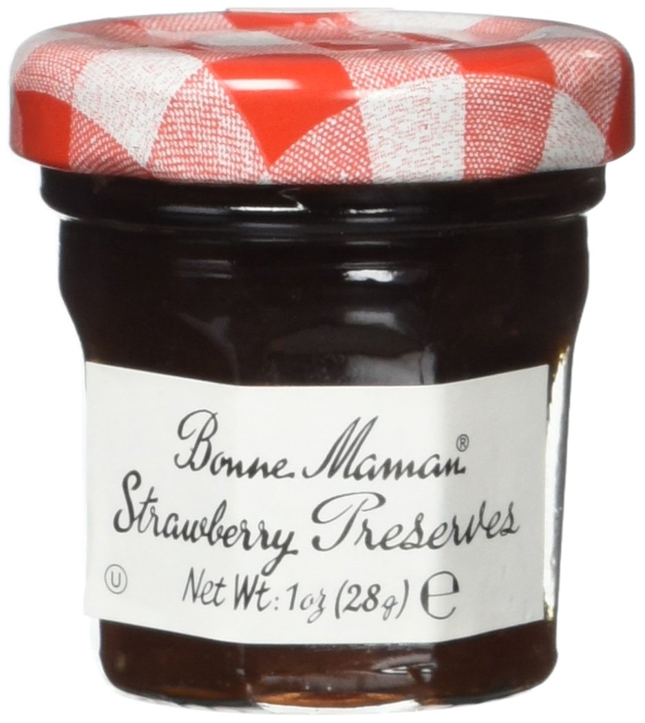 Bonne Maman on a breakfast table with toast and coffee, adds homemade strawberry flavor