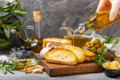 Bono olive oil pouring into a pan for even cooking performance