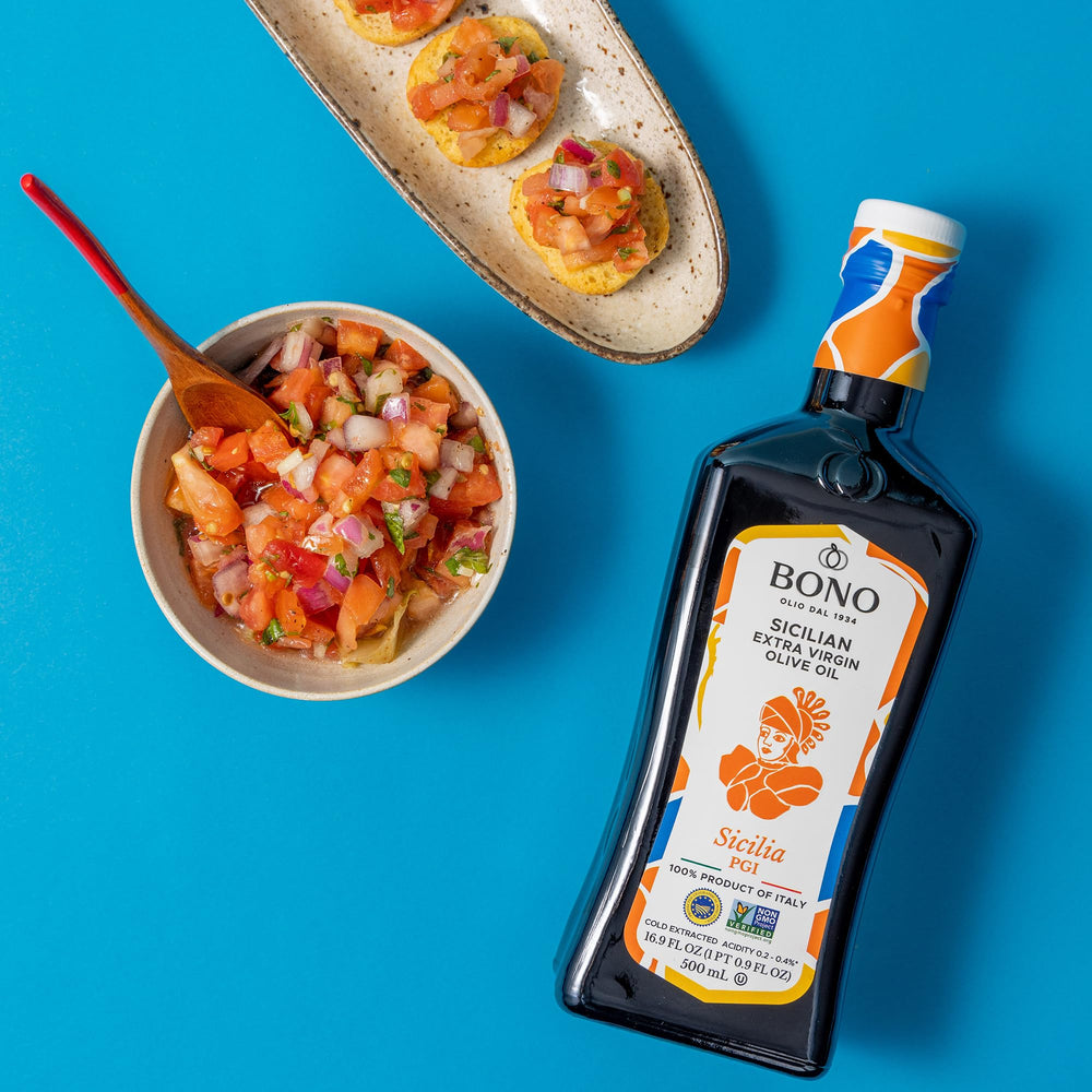 Bono olive oil being poured over bread to enhance flavor