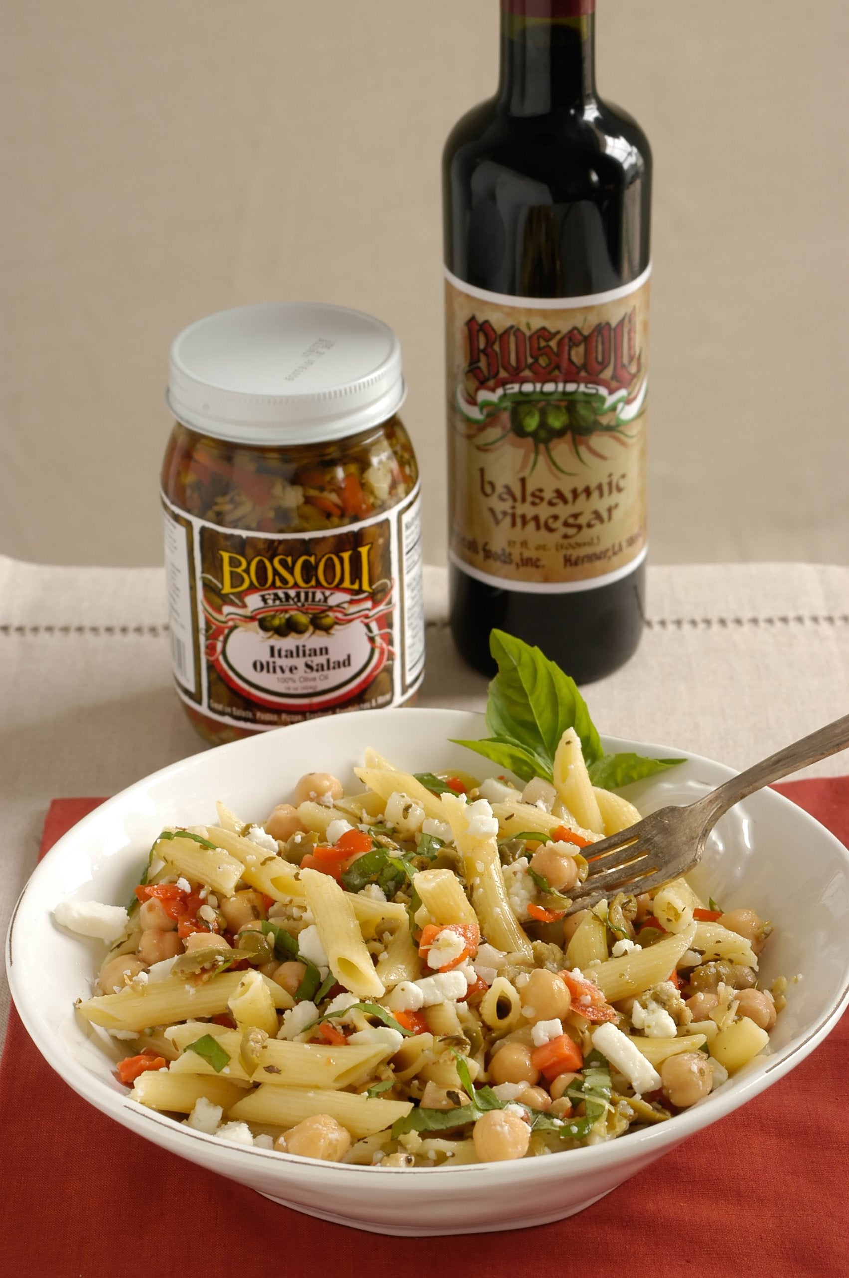Boscoli Family olive salad layered in muffuletta sandwich adding bold flavor