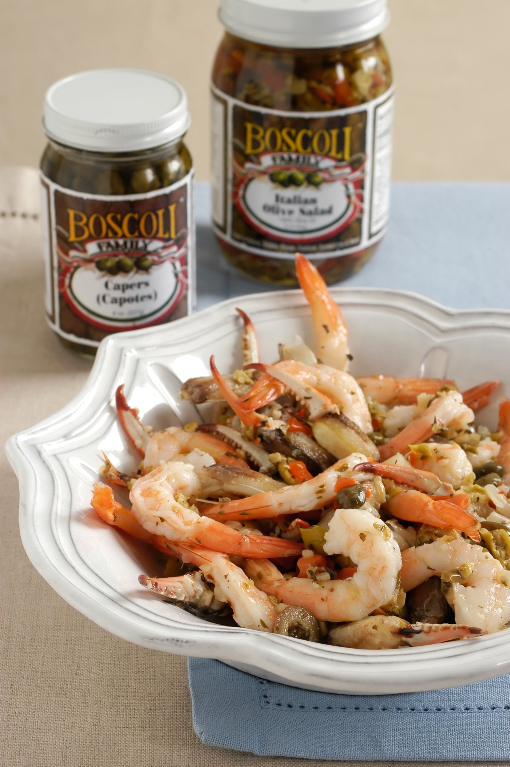 Boscoli Family olive salad spooned over mixed greens for vibrant salads