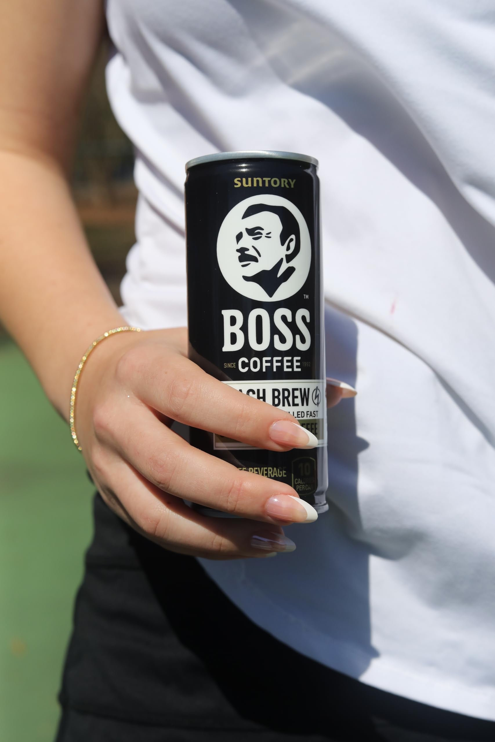 BOSS coffee scale comparison in hand showing compact 8oz travel size
