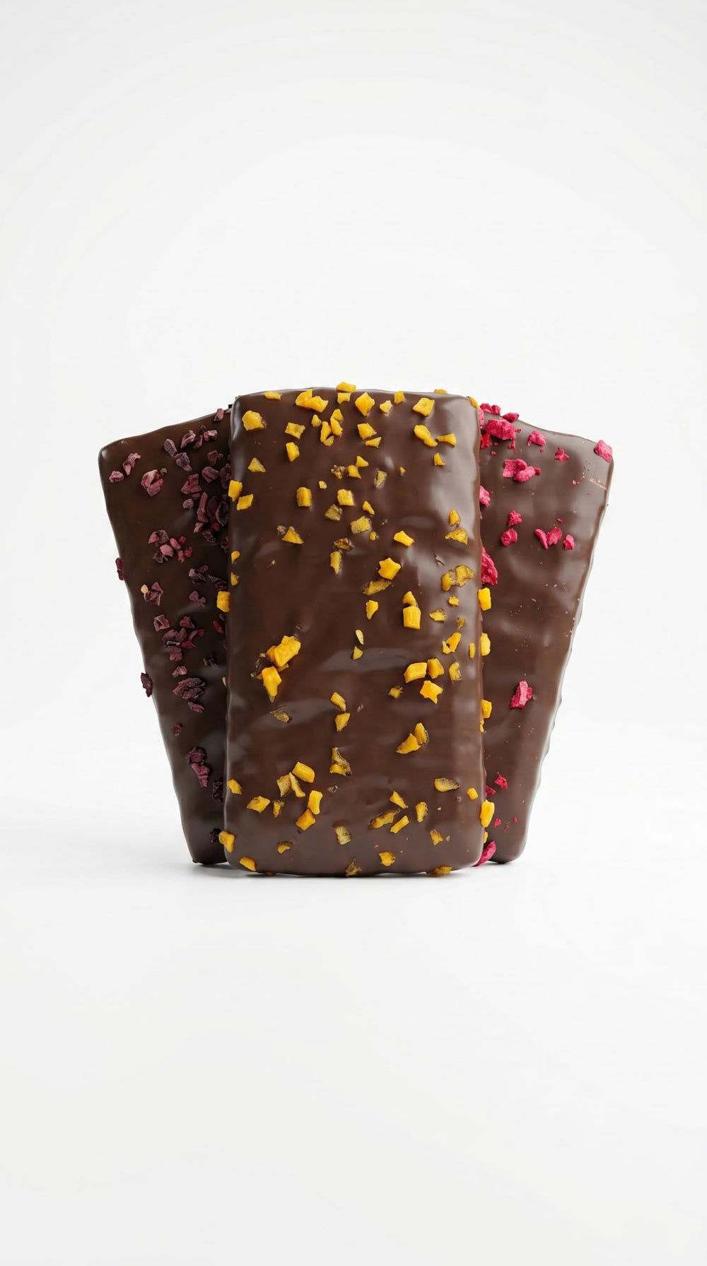 Bouchard close-up of dark chocolate surface and freeze-dried fruit pieces highlighting texture
