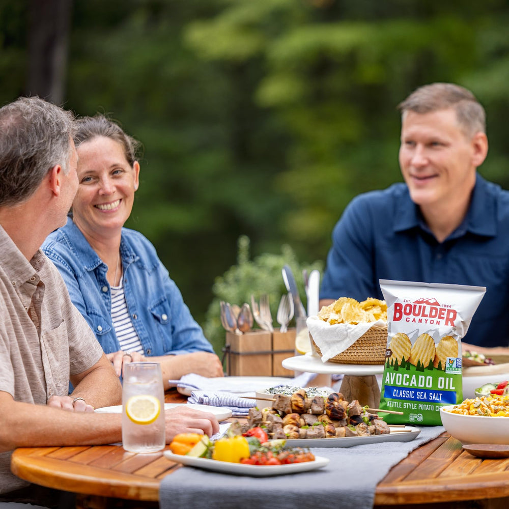 Boulder Canyon chips dipped into salsa demonstrating sturdy scoopable crunch