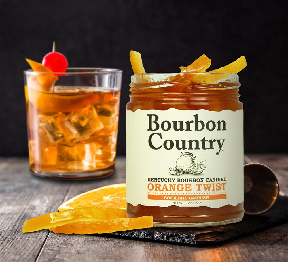 Bourbon Country orange twist perched on an Old Fashioned glass adding citrus aroma and elegance