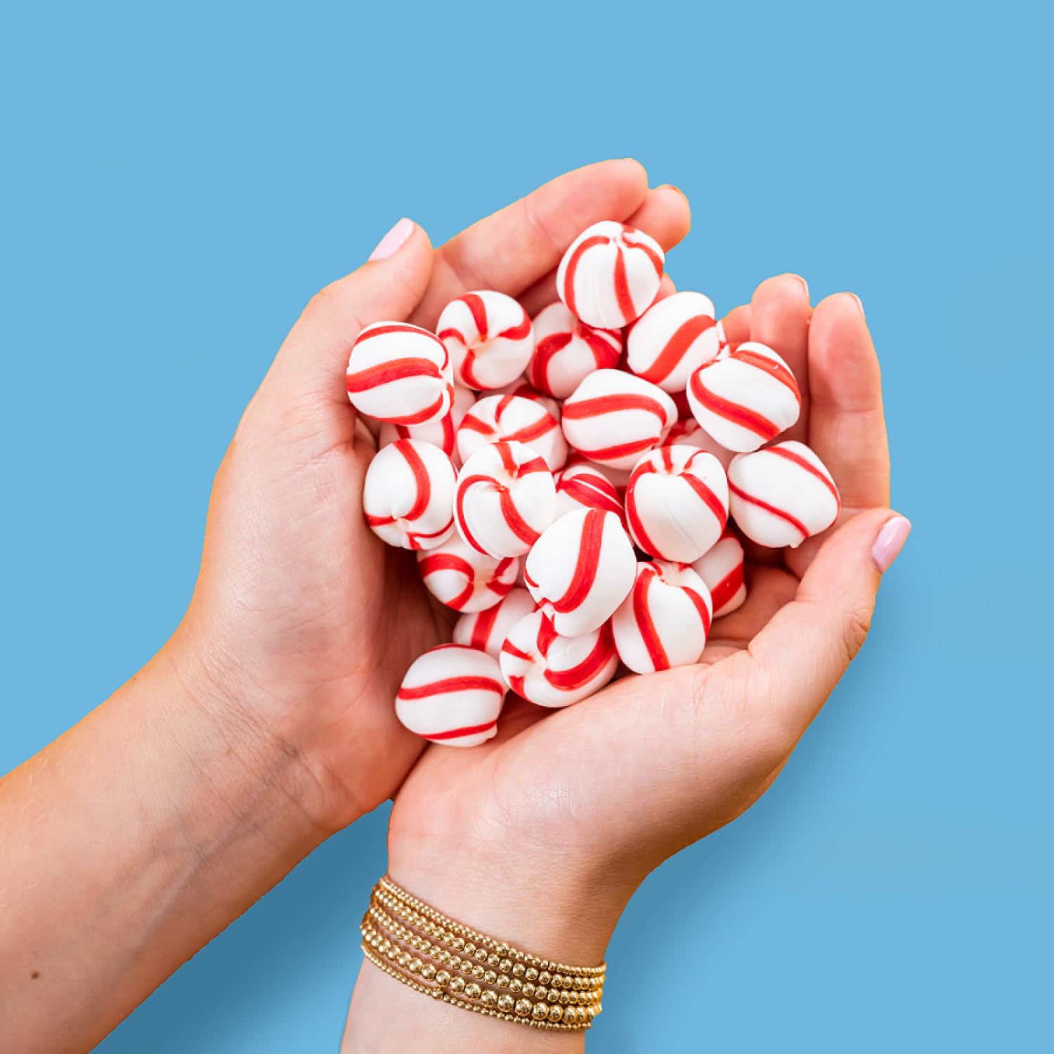 Candy dish filled with Brach's Sweet Stripes in a holiday setting for festive sharing