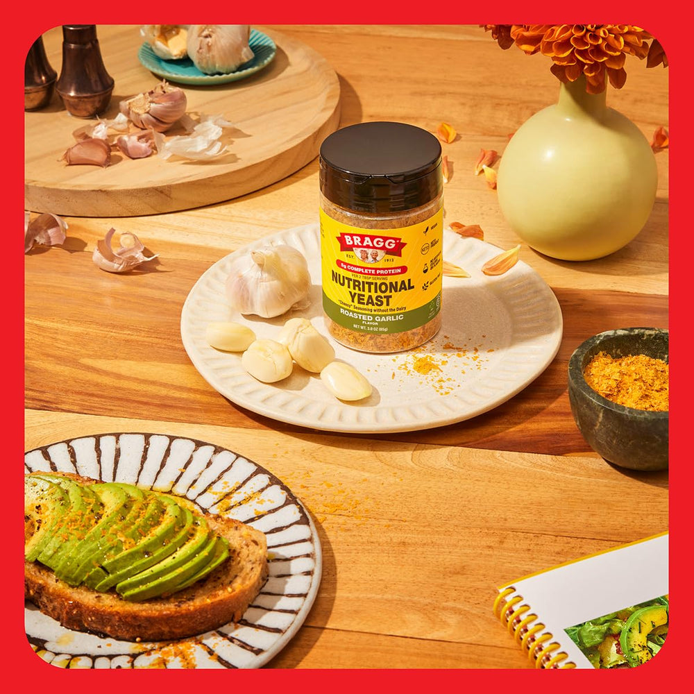 Spoonful of Bragg seasoning showing flaky texture and protein-rich formula