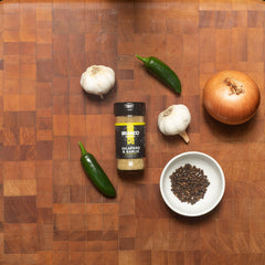 Bravado Spice close-up of seasoning texture showing jalapeño flakes and garlic, emphasizes freshness