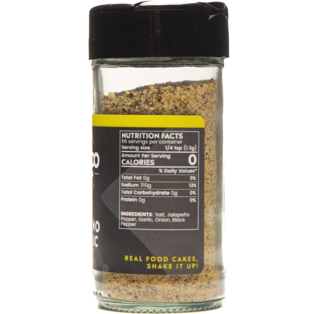 Bravado Spice 3 oz bottle held in hand to show scale and portability for cooking