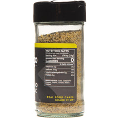 Bravado Spice 3 oz bottle held in hand to show scale and portability for cooking