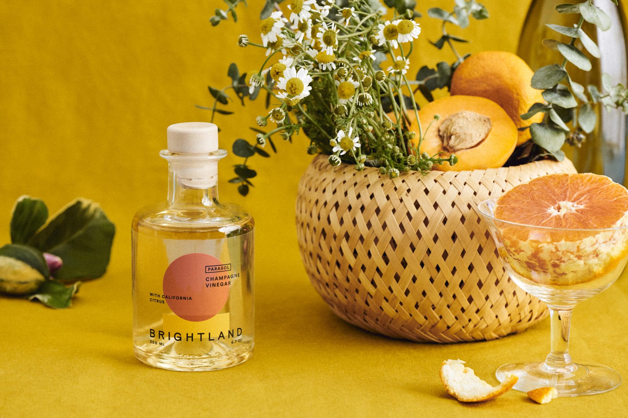 Brightland two 200ml bottles next to a measuring glass to show true scale
