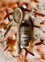 Britscookin jar open with visible garlic and herbs highlighting texture and aroma