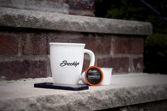 Brooklyn Beans brewed espresso cup with crema showing strong flavor payoff