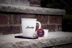 Brooklyn Beans pods beside mug showing portion size and ready-to-drink benefit