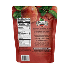 Brothers All Natural pouch in hand to show scale and lightweight portability for travel snacks