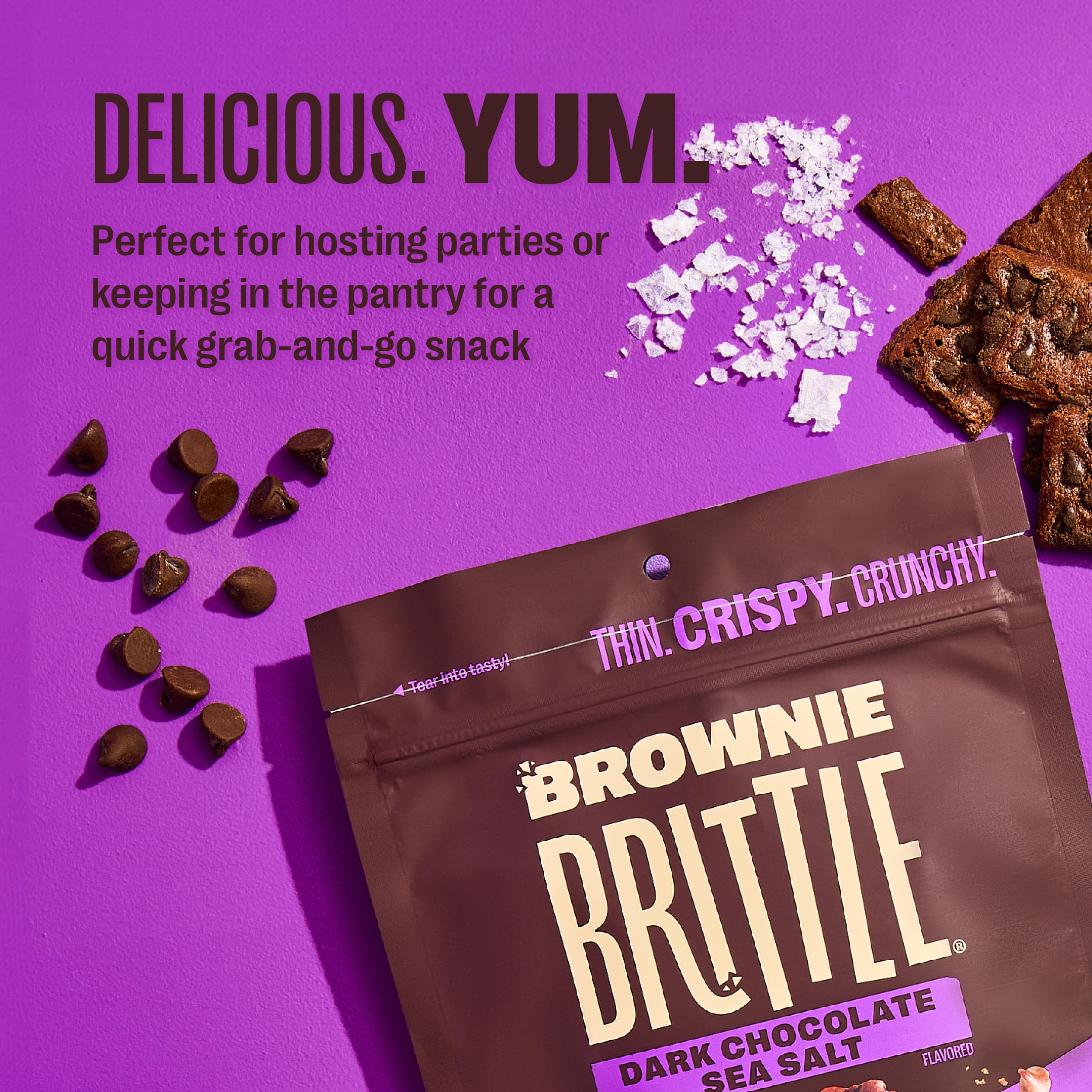 Brownie Brittle crumbs on ice cream adding crunchy chocolate contrast