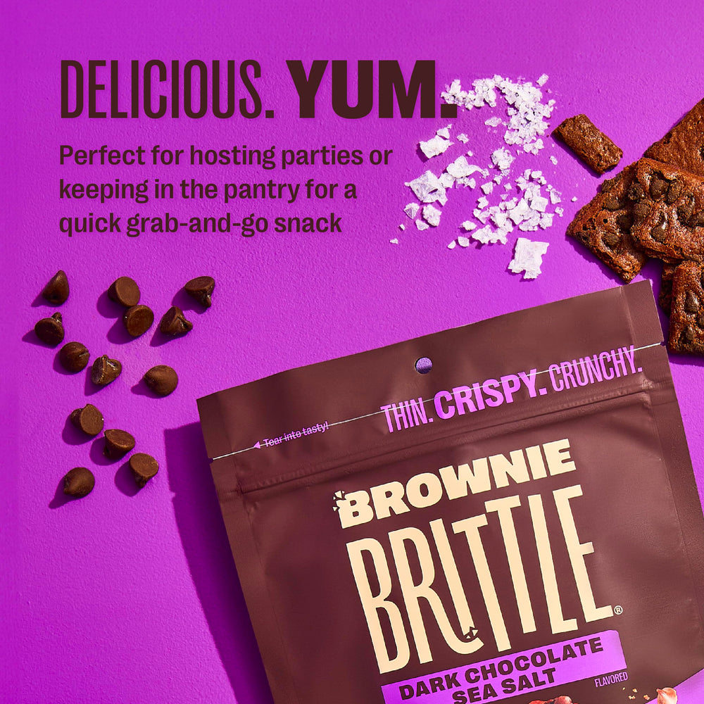 Brownie Brittle crumbs on ice cream adding crunchy chocolate contrast