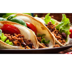Buena Vida spice sprinkled on tacos showing enhanced flavor and convenience