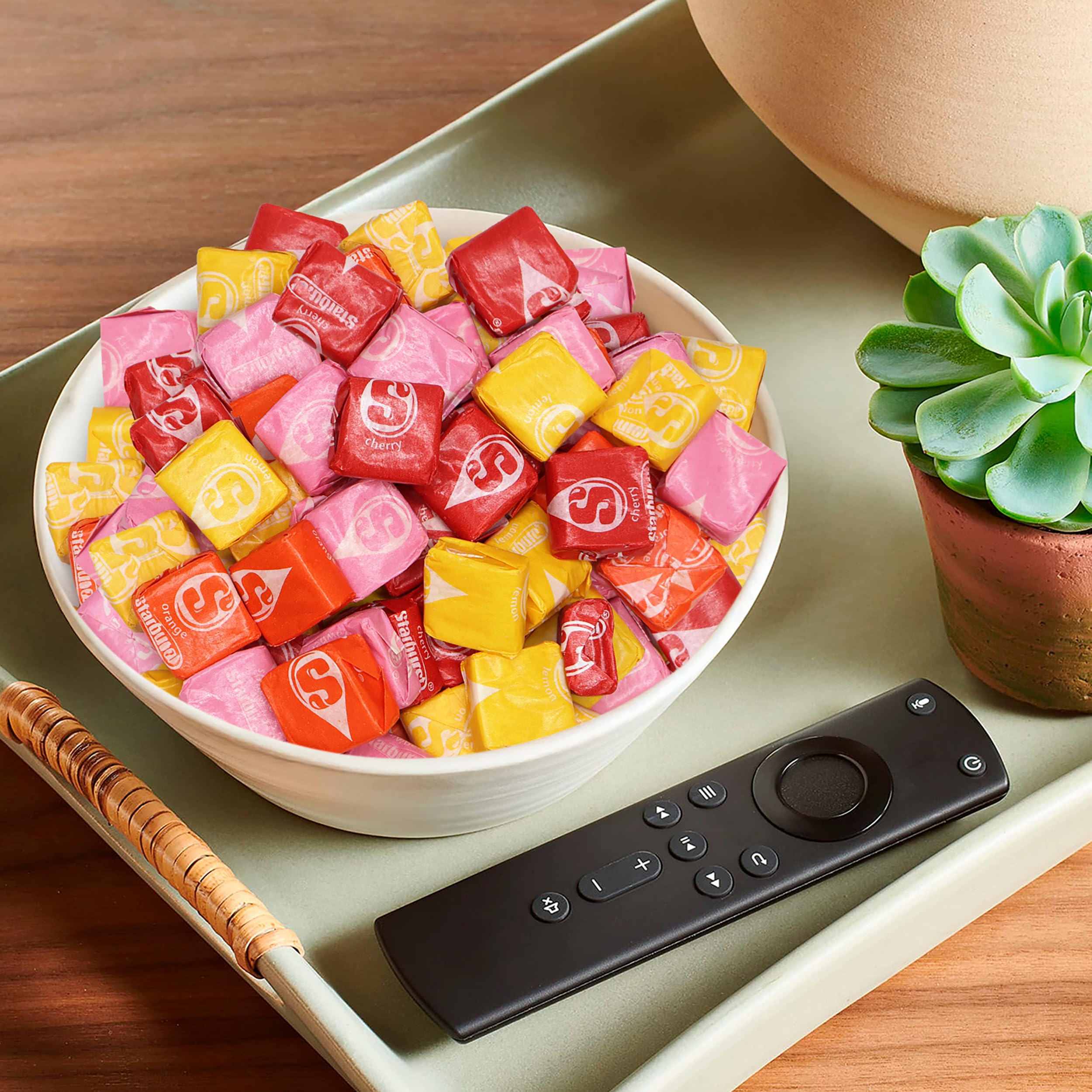 Buha Sweets piece held in hand to show scale and portion convenience