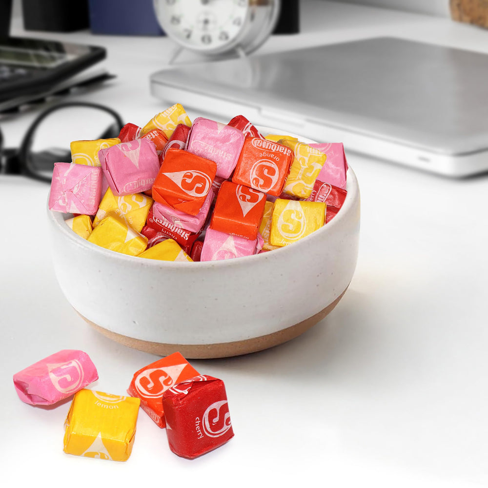 Buha Sweets pile of individually wrapped chews ready for party favor distribution