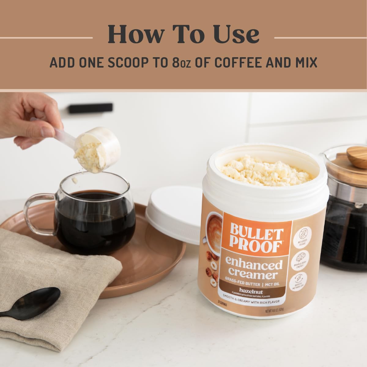 Scoop of Bulletproof creamer beside cup showing portion control advantage