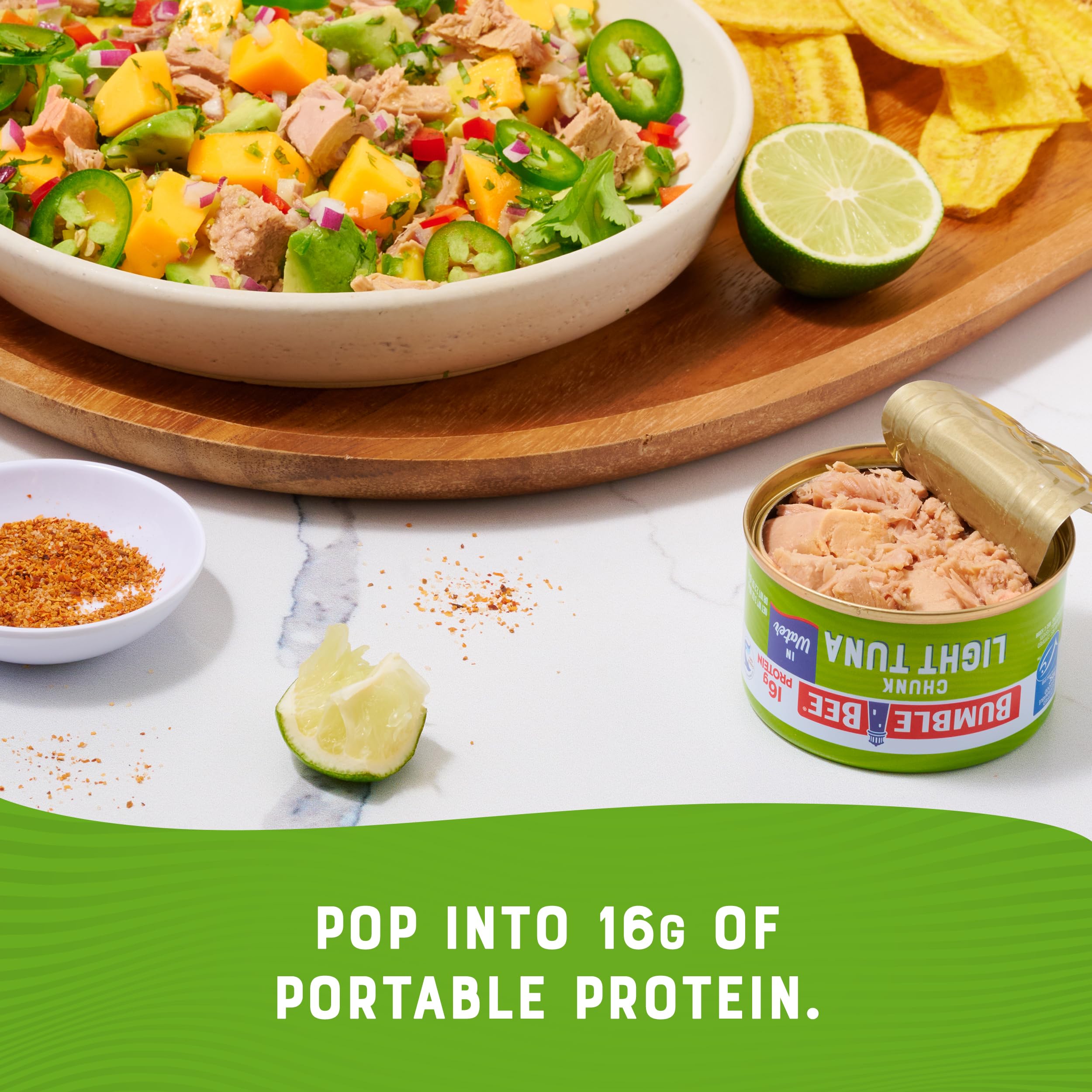 Bumble Bee tuna tossed in salad bowl, adds protein to greens