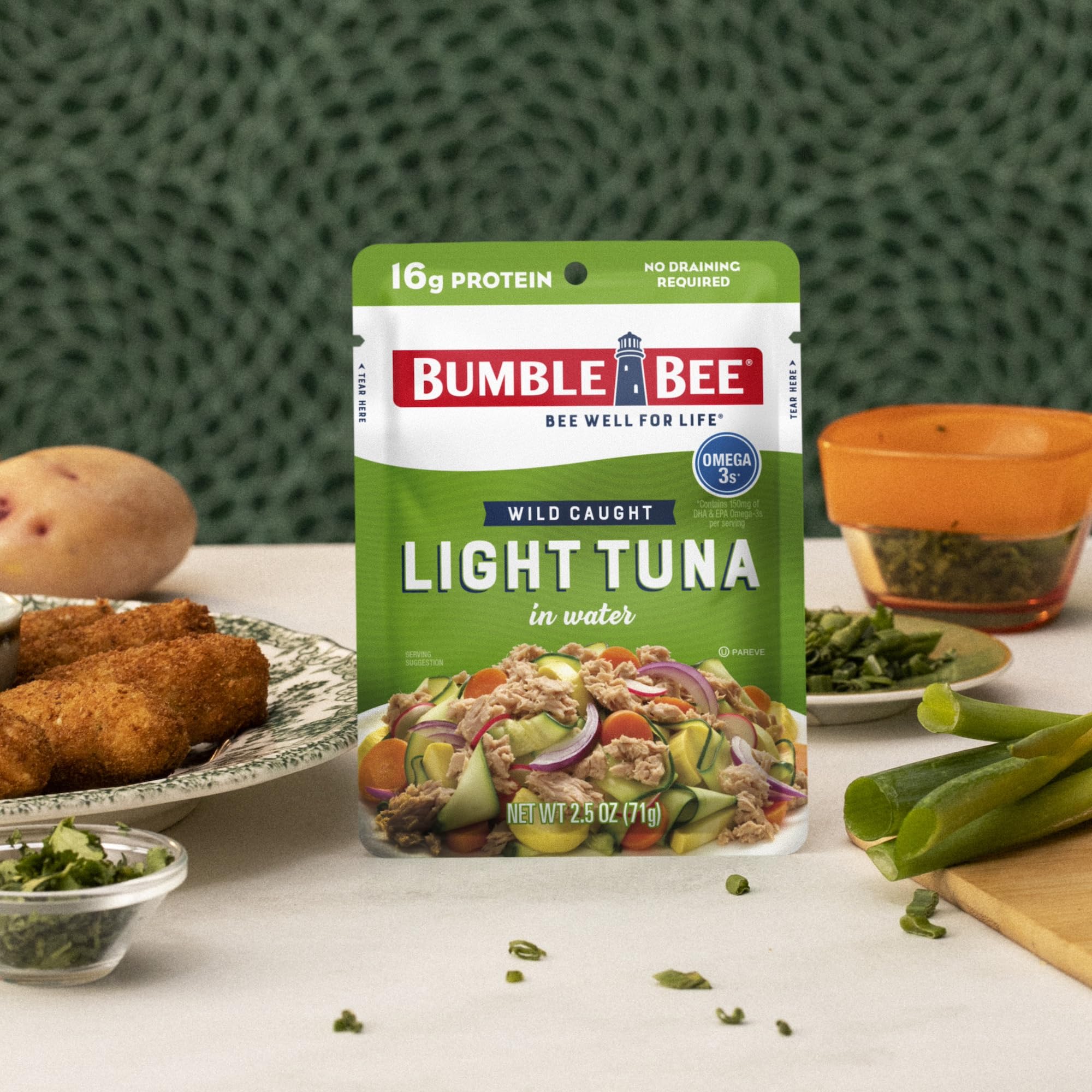 Bumble Bee pouch held in hand showing compact size and single-serve benefit
