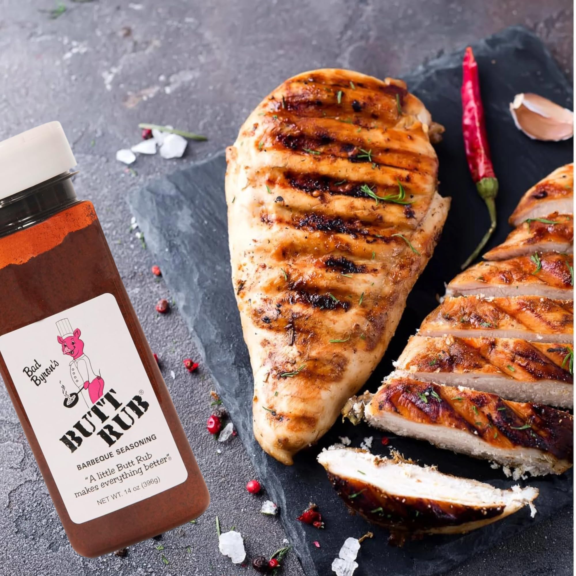 Butt Rub beside wooden spoon with spices highlighting natural ingredients