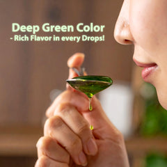 Butterfly pandan extract pouring into spoon to show measured, drop-by-drop control